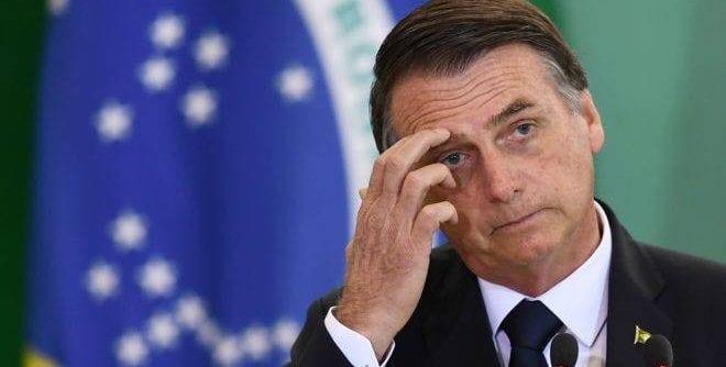 "A floresta não está pegando fogo como o pessoal está dizendo", diz Bolsonaro